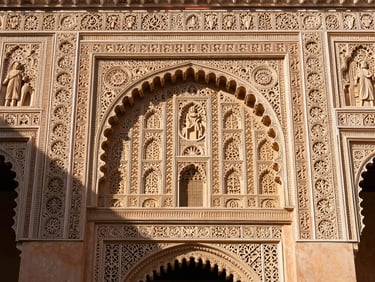 Close-up of intricate plasterwork and stuccos inside the Mexuar hall, soft morning light revealing architectural details