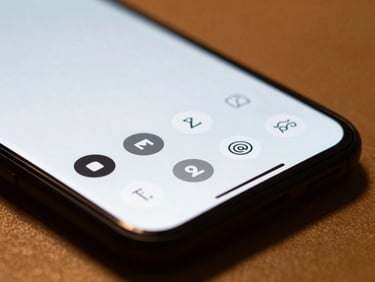 Macro close-up of a Nothing Phone displaying a minimalist monochrome app launcher, soft amber backlighting, shallow depth of field