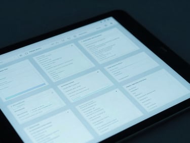Close-up of clean design wireframes on a tablet screen, moody cyan studio lighting