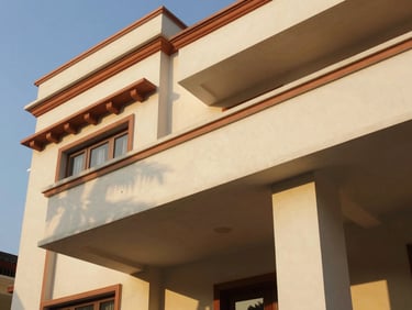 Architectural close-up of a premium villa facade in Andhra Pradesh, clean lines, terracotta accents, warm golden hour sunlight casting long shadows.