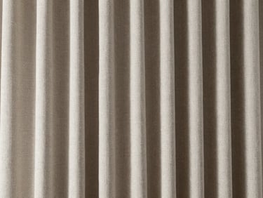 Extreme macro close-up of a perfectly pleated, high-thread-count linen curtain, showing rich texture and crisp folds under architectural light.