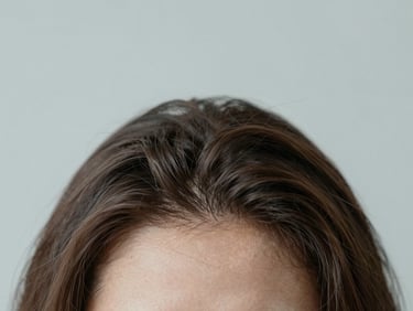 Macro photography of clean, healthy scalp parting with lustrous hair roots under soft diffused daylight, 35mm
