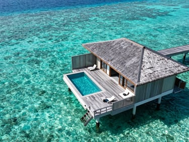 Top-down architectural view of a private luxury overwater villa in Maldives, crystal clear turquoise water, empty wooden deck, high-end editorial style