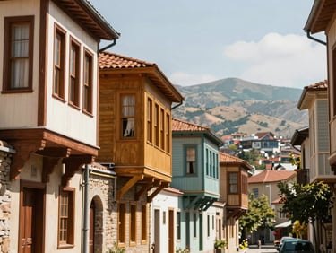 Sun-drenched historic street in Tbilisi, Georgia, with colorful wooden balconies and mountain backdrop, warm daylight