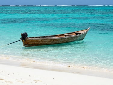 Crystal clear turquoise water of the Maldives with a traditional wooden dhoni boat floating near a white sand beach, bright daylight