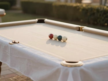 A perfectly set poolside table under a canopy at golden hour, crisp white linen, champagne gold accents, warm natural light, shallow depth of field.