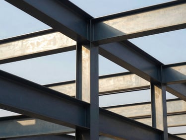 Abstract geometric structure of modern steel beams reflecting bright sunlight, representing structural growth and engineering