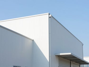 Bright architectural close-up of a modern logistics hub under clear blue skies, high-key daylight, 35mm