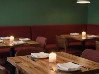Cozy Scandinavian-style restaurant dining room, candlelit wood tables, soft side-lighting, warm atmosphere.