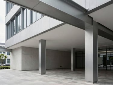 Crisp architectural photograph of a modern commercial office interior with clean lines and exposed steel columns, natural daylight