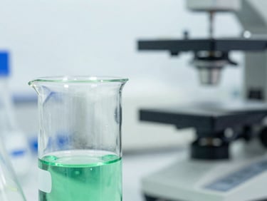 Macro close-up of clear liquid chemical sample in a clinical laboratory beaker, bright laboratory lighting, sterile environment