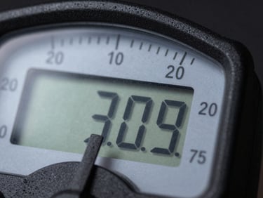 Macro shot of a digital meter's casing, highlighting the durable matte plastic and sealed construction under cool studio light.