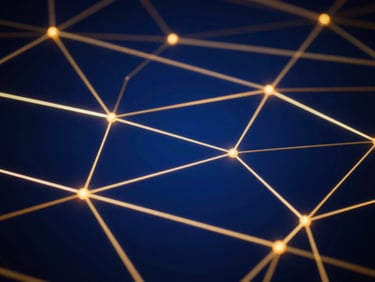 Abstract shot of interconnected glowing lines on a dark blue background, symbolizing data and network, with golden accents