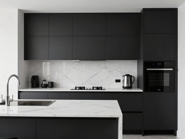 Modern minimalist kitchen with matte black cabinetry, clean white marble countertops, integrated appliances, and bright natural light.