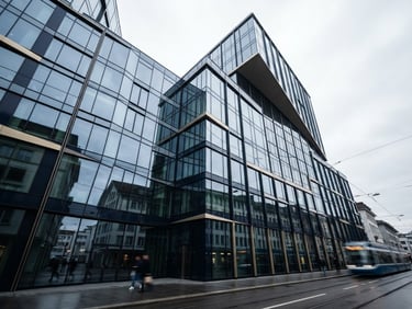 Low-angle architectural shot of a modern financial building in Zug, clean glass facade reflecting cool diffused Swiss daylight, sharp geometry, editorial corporate photography style.