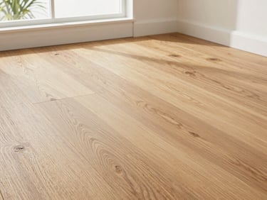 Crisp close-up of finished natural oak hardwood floor planks, bright natural Florida daylight streaming through windows, sharp detail, low-angle floor-level shot.