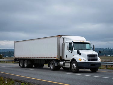 A commercial flatbed truck hauling cargo down Interstate Five near Tacoma, overcast sky, realistic Pacific Northwest lighting, 35mm lens