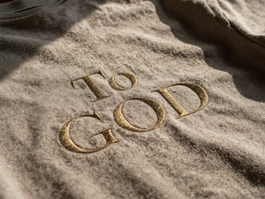 Detailed shot of a Letters to God garment texture, subtle gold accent, dramatic shadows, 35mm.