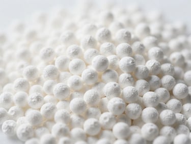 Macro technical shot of pure white urea 46% granules, perfectly uniform spherical shape, clean laboratory lighting, shallow depth of field.