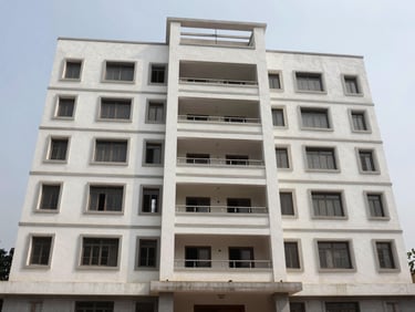 Exterior facade of a mid-rise residential building in Vasna Bhayli Vadodara, overcast daylight, clean architectural lines, no people or signage