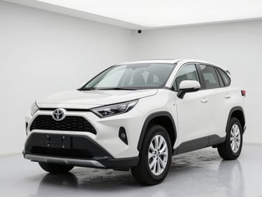 Eye-level three-quarter portrait of a clean white Toyota SUV parked inside a bright, modern showroom with clean white studio lighting, sharp focus, 50mm lens.