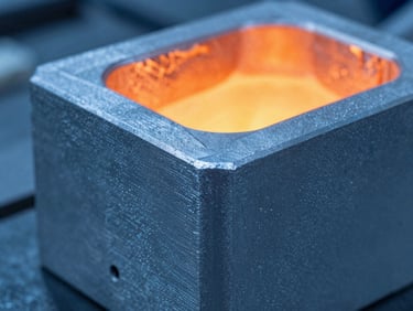 Close-up macro shot of a finished aluminum casting showing clean edges and precise metallic texture, cool blue industrial lighting, sharp focus