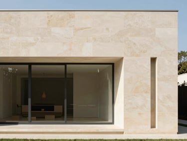 Minimalist modern villa facade, clean lines, warm stone, bright natural daylight, soft shadows, architectural photography