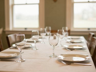 Beautifully arranged dining space for a private celebration, warm golden light, elegant glassware, 35mm