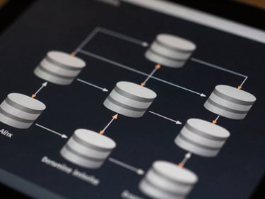 Crisp technical system architecture diagram on a dark screen, showing clean API integration pathways and database connections with subtle orange highlights, macro crop, high contrast.