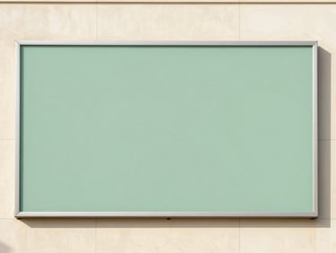 Clean architectural shot of a large format outdoor advertisement on a building facade in Riyadh, bright daylight, subtle sage green in the ad design, 35mm