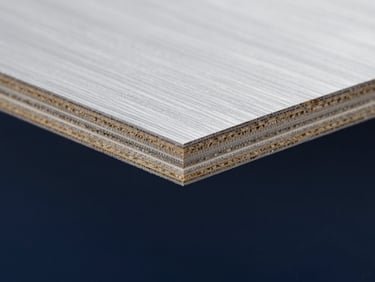 Macro close-up of F17 formply edge-sealing chemistry, showing the dense multi-layered cross-laminated timber grain, sharp technical focus.