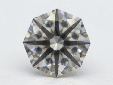 Extreme close-up macro of a D-color round brilliant diamond on a white light table, studio north-facing daylight, facets rendering sharp octahedral geometry, no background detail