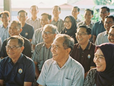 Group photo of SMEAN Karawang 93 alumni laughing together at a recent reunion, warm natural golden-hour light, soft faded vintage analog tones, 35mm film aesthetic