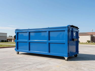 A clean sky blue 15-yard roll-off dumpster on a pristine concrete driveway under bright morning sun