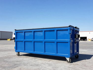 A clean sky blue 20-yard dumpster on an organized commercial job site under clear blue skies