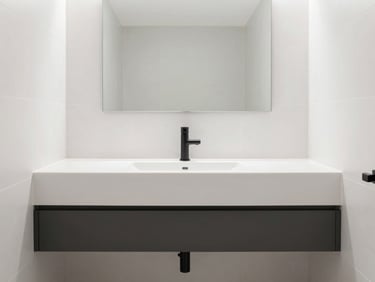 Modern luxury washroom, clean white stone tiles, floating vanity, matte black hardware, bright natural light, 35mm