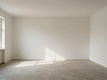 Wide shot of a restored, empty room with clean pale walls and bare floor, soft northern daylight entering from one side, quiet and still, ready to inhabit again