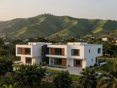 A wide panoramic view of a modern custom-built villa in Sector E-7, Islamabad, framed against the lush green Margalla Hills during golden hour.
