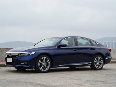 Front three-quarter driver-side profile of a midnight blue Honda Accord, overcast Hong Kong daylight, full vehicle visible, squared frame, no tilt