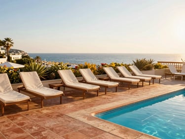Boutique hotel pool area during golden hour, sun loungers, terracotta tiles, warm coastal evening light