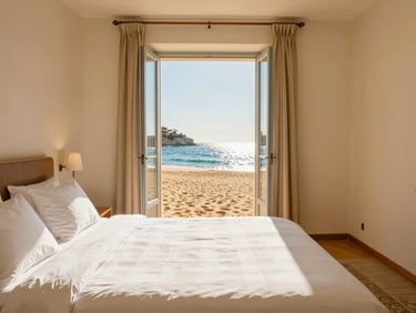 Luminous hotel room interior with white linens, bright Mediterranean sunlight streaming through a window, warm sand tones