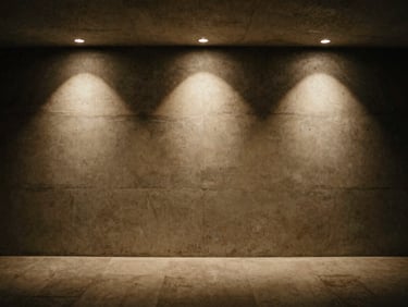 Wide architectural shot of a minimalist hotel lobby wall evenly illuminated by soft, indirect overhead lighting.