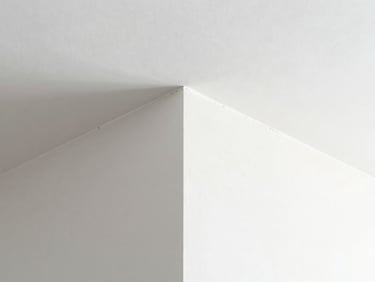 Macro shot of a perfectly finished drywall corner, seamless joints, bright architectural light, minimalist white tones