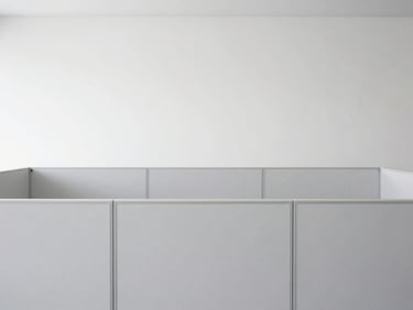 Straight-on architectural shot of a clean minimalist office partition wall showing integrated cable channels, elegant grey finishes
