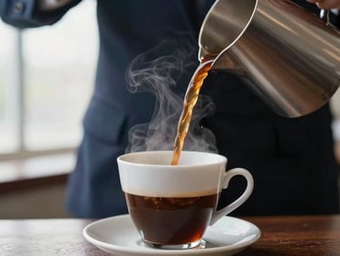 Close-up of freshly brewed coffee being poured into an elegant cup, steam rising, rich espresso brown tones, bright natural morning light, shallow depth of field, professional corporate catering.