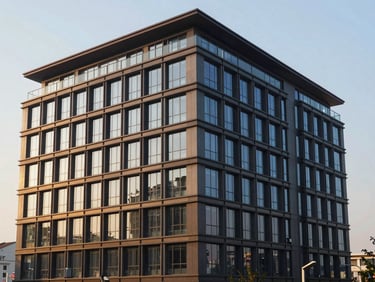 Modern commercial building exterior with clean architectural lines, crisp morning light, structured elevation