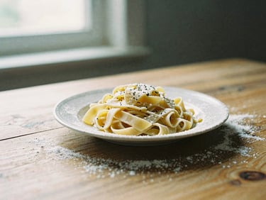 Close-up of a rustic wooden table with a single plate of handmade pasta, dustings of flour, soft morning window light, rich organic tones, 35mm film.