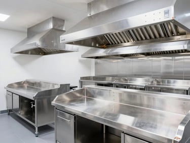 Bright commercial cloud kitchen interior, professional exhaust hoods, clean welds on prep stations.