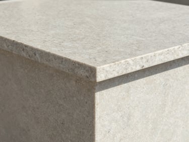 editorial architectural photography of a mitered corner joint on a quartzite countertop, perfect alignment, soft coastal light