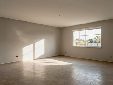 Wide-angle interior shot of a freshly built house living room with tiled floor, neutral wall paint, large window letting in afternoon sunlight, Tocantins